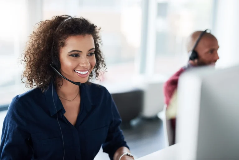 Clinical Support service employee gladly answering call on the headphone