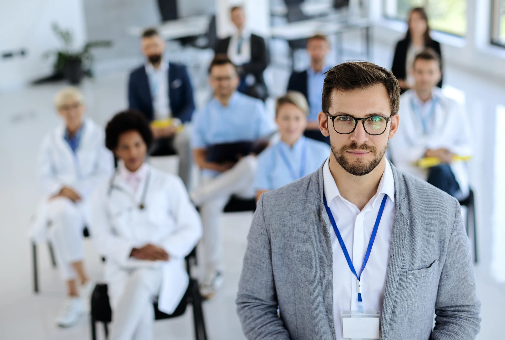 A group of doctors and nurses in seminar classroom.