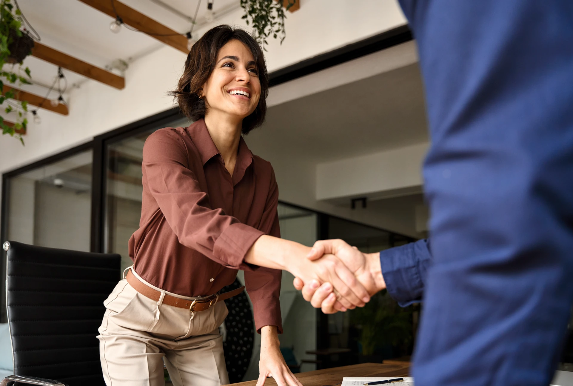 HR giving a new employee a handshake